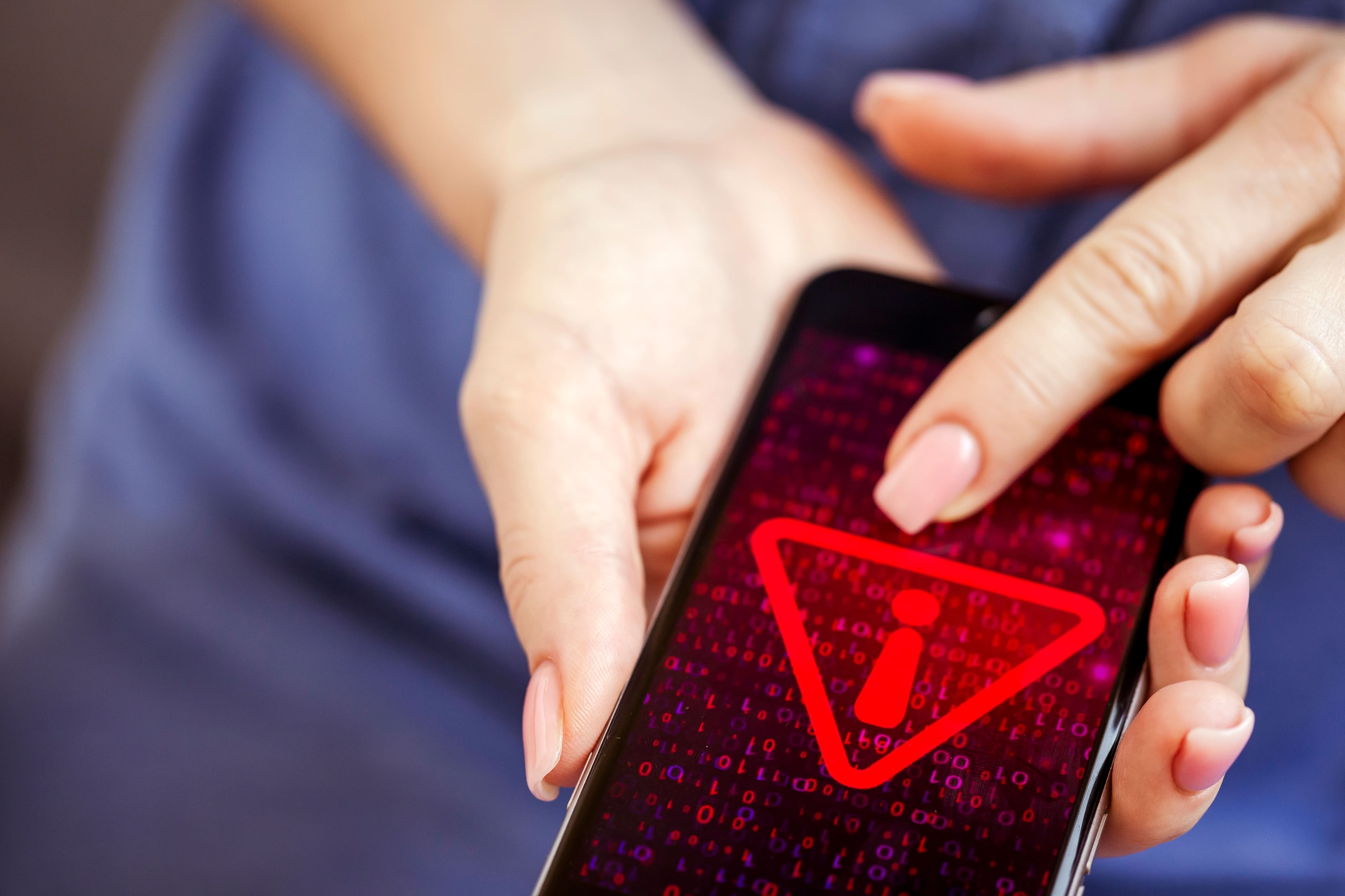 mobile-phone-in-female-hands-with-screen-showing