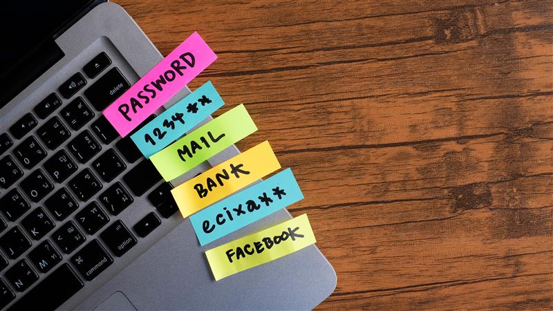 password management, password, mail, bank, facebook, message concept written post it on laptop keyboard.